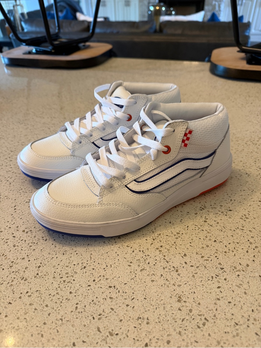 Men’s White Vans Sneakers with Blue and Red Accents